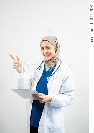 Muslim Arab person. The face of a female doctor on an isolated white background. 130755974