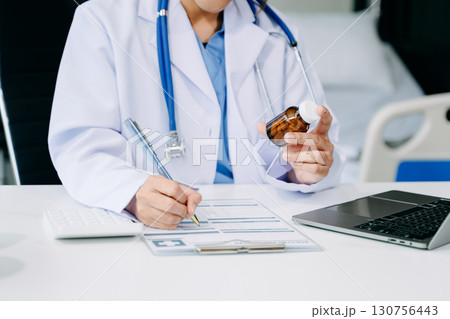 Medical technology concept. Doctor working with mobile phone and stethoscope and digital tablet laptop in modern office at hospital Medical technology concept. Doctor working with mobile phone and stethoscope and digital tablet laptop in modern office at hospital 130756443