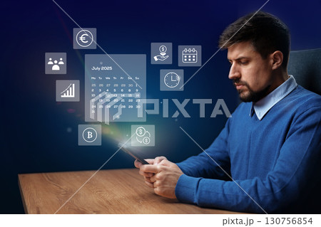Man using tablet with financial tools and calendar in a modern office setting Man using tablet with financial tools and calendar in a modern office setting 130756854
