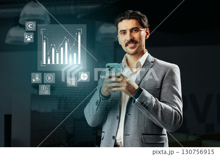 Professional man using smartphone with data analytics display in modern office environment during daytime hours Professional man using smartphone with data analytics display in modern office environment during daytime hours 130756915