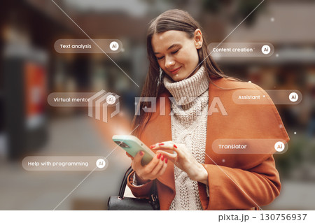 Young woman exploring AI applications while using smartphone in urban setting during daytime Young woman exploring AI applications while using smartphone in urban setting during daytime 130756937