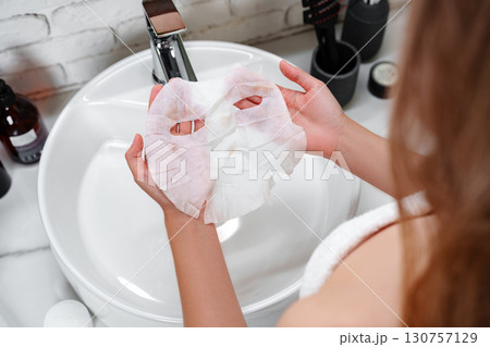 Relaxing skincare routine in a modern bathroom with a facial mask being prepared in the morning Relaxing skincare routine in a modern bathroom with a facial mask being prepared in the morning 130757129