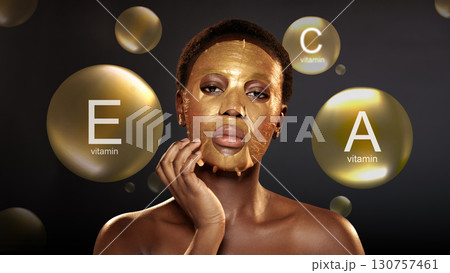 Woman applying gold facial mask in spa setting, emphasizing skincare and beauty routine at evening Woman applying gold facial mask in spa setting, emphasizing skincare and beauty routine at evening 130757461
