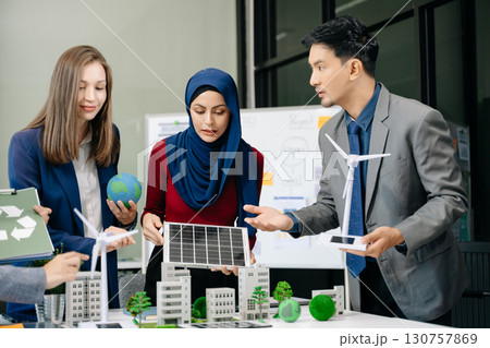 business team people planning and discussing on recycle reduce reuse policy symbol in office meeting room. Green business company and Solar Energy Environment city 130757869