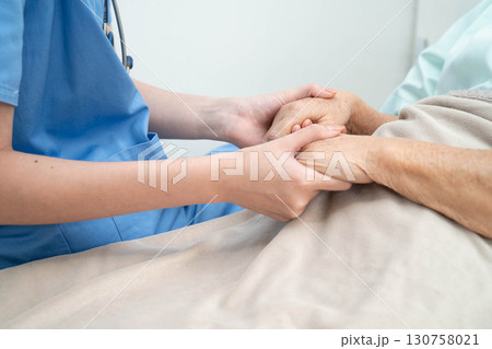 Asian doctor checking and treat elderly woman patient health in hospital. Asian doctor checking and treat elderly woman patient health in hospital. 130758021