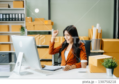 Startup small business SME, Entrepreneur owner woman using smartphone or tablet taking receive and checking Startup small business SME, Entrepreneur owner woman using smartphone or tablet taking receive and checking 130758218