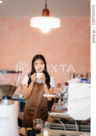 Explore professional Asian baristas brewing coffee, using notepads, digital tablets, and showcasing coffee Explore professional Asian baristas brewing coffee, using notepads, digital tablets, and showcasing coffee 130758355