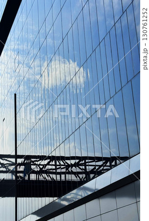 Tall building reflecting the sky with copy space 130761252