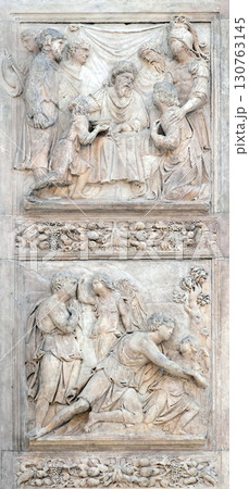 Jacob and the Angel by Niccolo Tribolo up and Benjamin brings the cup to Pharaoh by Francesco da Milano, left door of San Petronio Basilica in Bologna, Italy 130763145