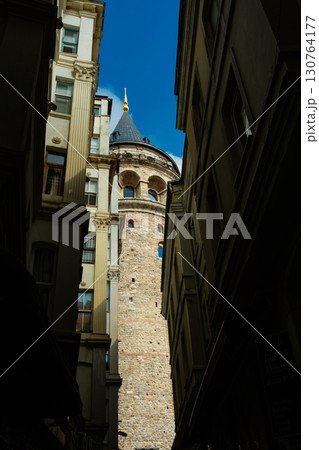 Istanbul, Turkey. View of Galata tower through the streets with tight buildings. Travel attraction. Islamic architecture 130764177