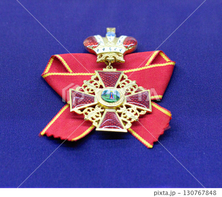 Golden royal order of sahametrei medallion resting on blue velvet 130767848