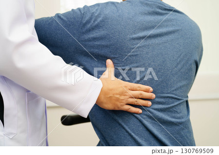 Physical therapy, Asian therapist doctor treat perform pain therapy in hospital. 130769509