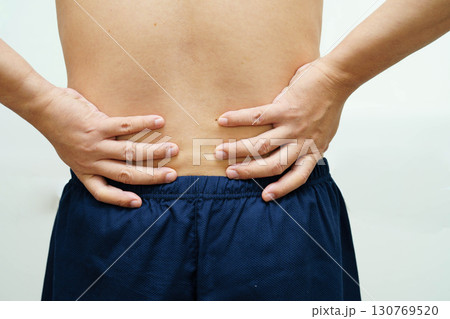Asian man pain back muscle, spine and bone from accident. 130769520