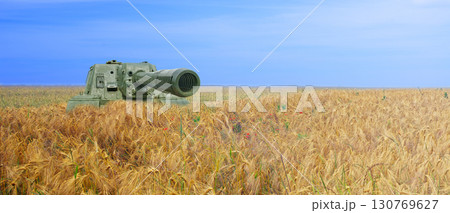 Tank on the field of yellow wheat and blue sky. The concept of war in Ukraine. Ukraine flag colors concept 130769627