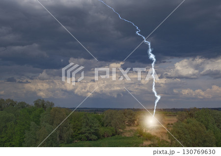 Lightning strike in field in the evening in the countryside Lightning strike in field in the evening in the countryside 130769630