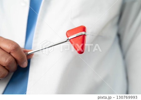 Asian doctor holding court hammer for and crime law justice, forensic medicine. Asian doctor holding court hammer for and crime law justice, forensic medicine. 130769993