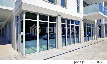 Panoramic windows of new commercial premises. Commercial property in development standard for rent. Panoramic windows of new commercial premises. Commercial property in development standard for rent. 130770720