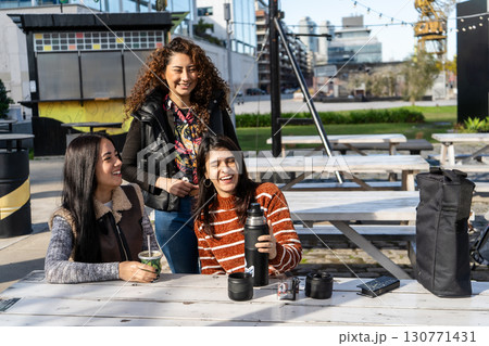 Three latin american women sharing mate in buenos aires Three latin american women sharing mate in buenos aires 130771431