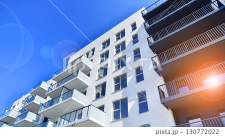 Architectural details of modern apartment building. Modern european residential apartment building complex. 130772022