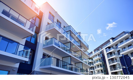 Architectural details of modern apartment building. Modern european residential apartment building complex. 130772045