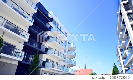 Architectural details of modern apartment building. Modern european residential apartment building complex. 130772060