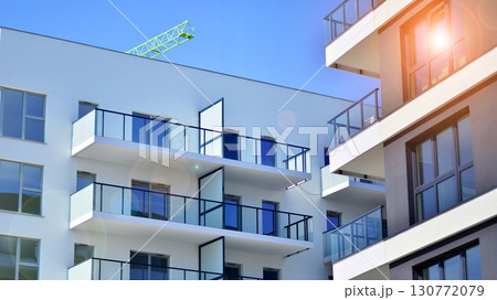 Architectural details of modern apartment building. Modern european residential apartment building complex. Architectural details of modern apartment building. Modern european residential apartment building complex. 130772079