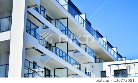 Architectural details of modern apartment building. Modern european residential apartment building complex. Architectural details of modern apartment building. Modern european residential apartment building complex. 130772081
