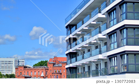 Architectural details of modern apartment building. Modern european residential apartment building complex. 130772083