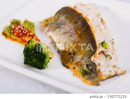 Grilled trout with broccoli and tartar Grilled trout with broccoli and tartar 130772235