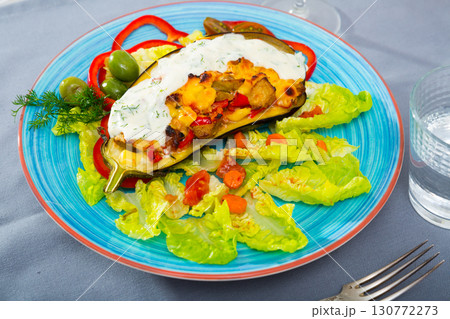 Eggplant with vegetables and baked cheese 130772273