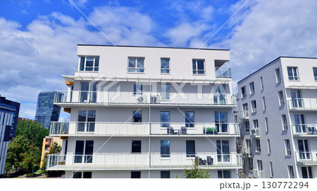Architectural details of modern apartment building. Modern european residential apartment building complex. 130772294