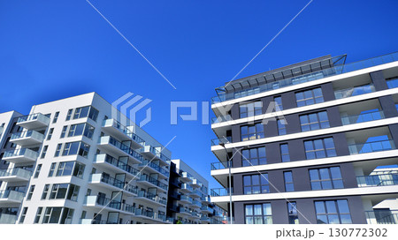 Architectural details of modern apartment building. Modern european residential apartment building complex. Architectural details of modern apartment building. Modern european residential apartment building complex. 130772302