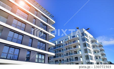 Architectural details of modern apartment building. Modern european residential apartment building complex. 130772303