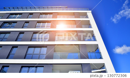 Architectural details of modern apartment building. Modern european residential apartment building complex. Architectural details of modern apartment building. Modern european residential apartment building complex. 130772306
