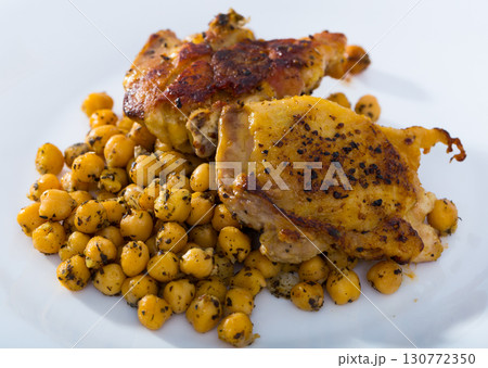 Roasted chicken thighs with chickpeas 130772350