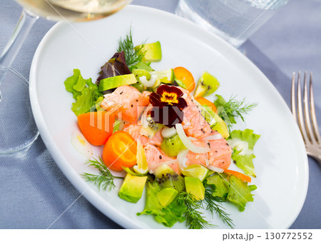 Ceviche of trout with avocado, cumquat, greens 130772552