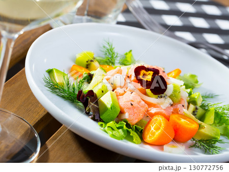Ceviche of trout with avocado, cumquat, greens 130772756