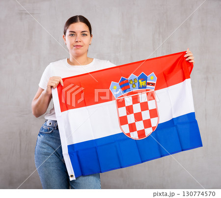 Positive woman supporting Croatia on world championship Positive woman supporting Croatia on world championship 130774570