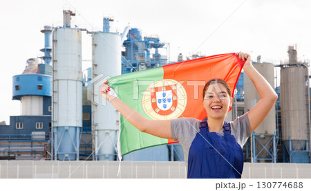 Smiling young woman holds the national flag of Portugal Smiling young woman holds the national flag of Portugal 130774688