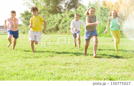 Boys and girls running 130775027
