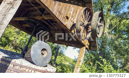 Antique shredder, branch crusher under a wooden roof in Slovakia. In working condition. 130775527