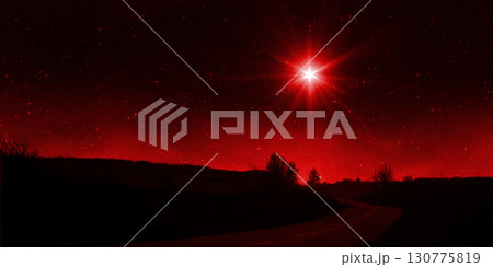 Bright red star shines over the road at night. Birth of Jesus concept, Star of Bethlehem 130775819
