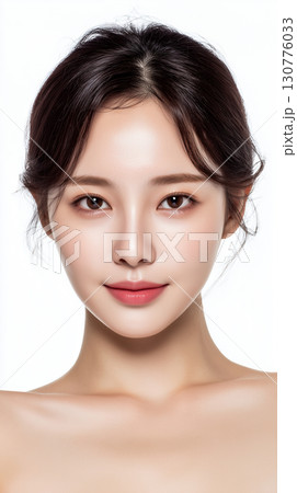 Portrait of a serene Asian woman showcasing flawless skin and natural beauty in a minimalist studio setting during bright lighting Portrait of a serene Asian woman showcasing flawless skin and natural beauty in a minimalist studio setting during bright lighting 130776033