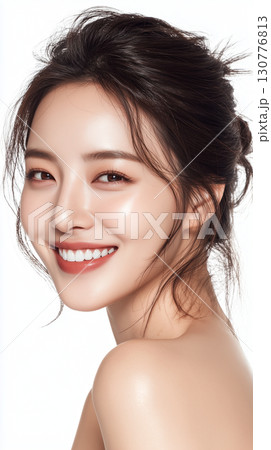 Smiling young woman with radiant skin posing gracefully against a bright background Smiling young woman with radiant skin posing gracefully against a bright background 130776813