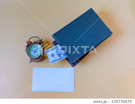 A pile of books with US banknotes,saving hidden. 130776878