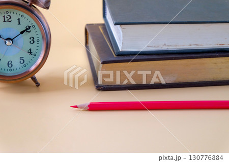 Red Pencil sticking out of the old book.planning education. Red Pencil sticking out of the old book.planning education. 130776884