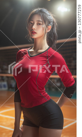 Young Korean volleyball player posing confidently on the court during a competitive match at sunset 130777259