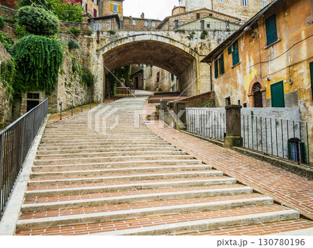 Stunning view of the roman aqueduct surrounded by colorful houses, Perugia, Italy Stunning view of the roman aqueduct surrounded by colorful houses, Perugia, Italy 130780196
