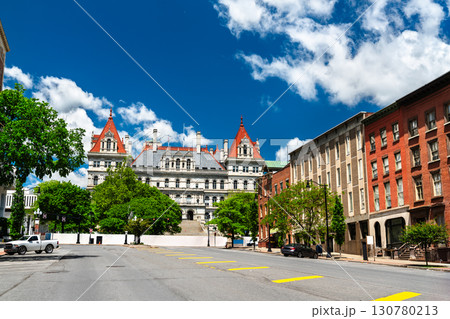 Street view of the historic New York State Capitol building, an architectural landmark in Albany USA, on a bright sunny day with a blue sky 130780213