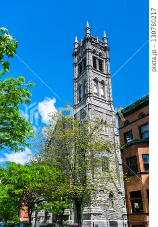 The stone Gothic Revival tower of the historic Emmanuel Baptist Church rises against a bright blue summer sky in Albany, New York, United States The stone Gothic Revival tower of the historic Emmanuel Baptist Church rises against a bright blue summer sky in Albany, New York, United States 130780217